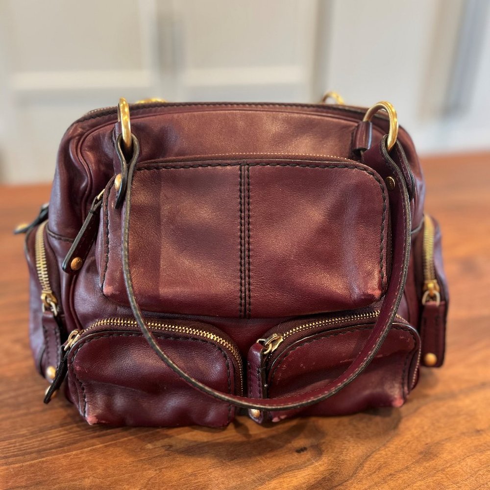 Tod's Burgundy Leather Handbag with Gold Hardware